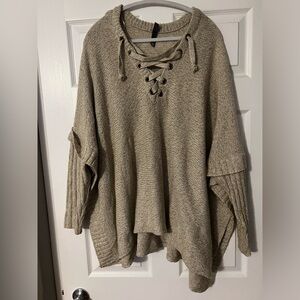 Francesca’s poncho-style sweater. Size Medium/Large.